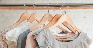Clothes hanging in a closet.