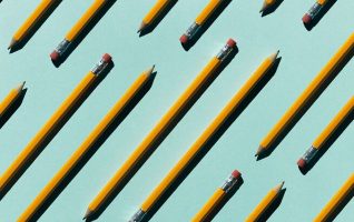 Pencils on a blue background.