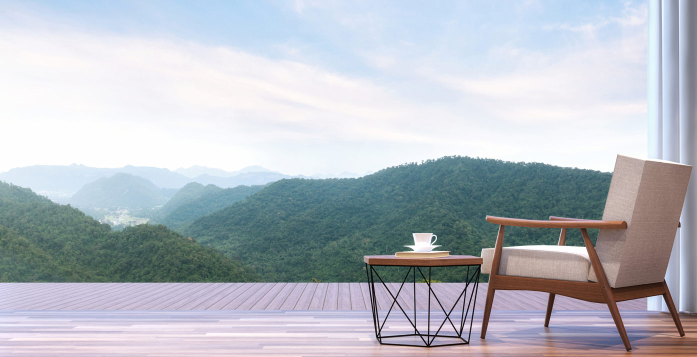 Chair and sidetable overlooking widow view of mountains