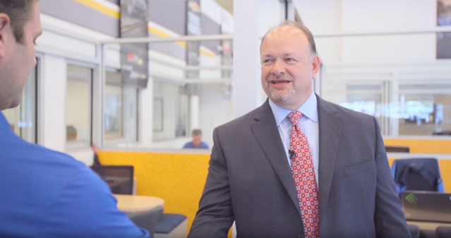 John Heister shaking man's hand