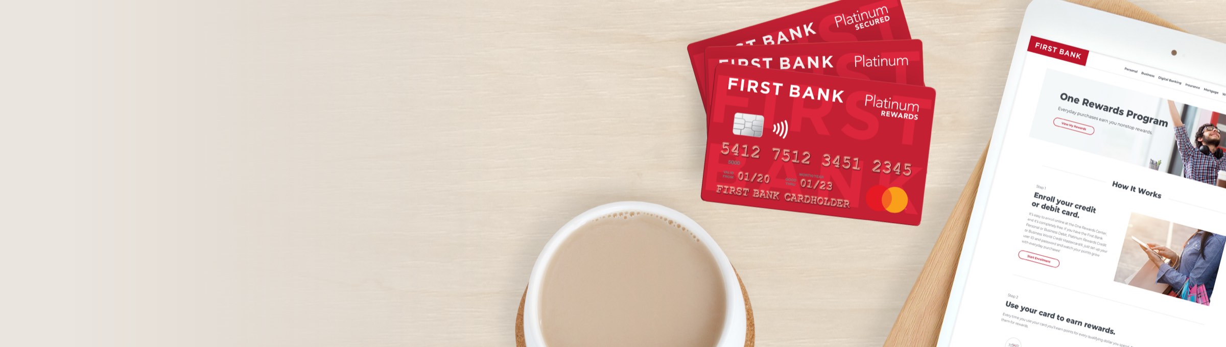 First Bank Credit Cards on table with coffee cup and ipad