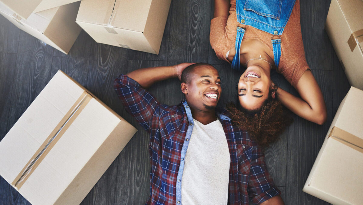 Shot of an attractive young couple moving house