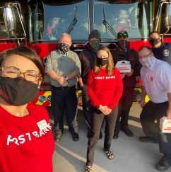 First Bank team members with volunteer firefighters