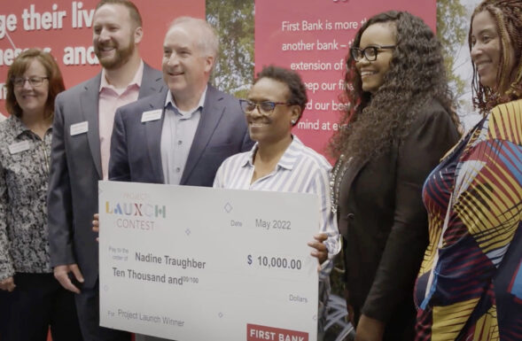 Nadine Traughber with Project Launch check