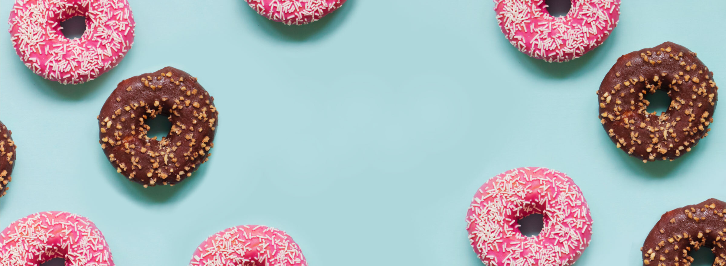 Glazed donuts on a blue background.