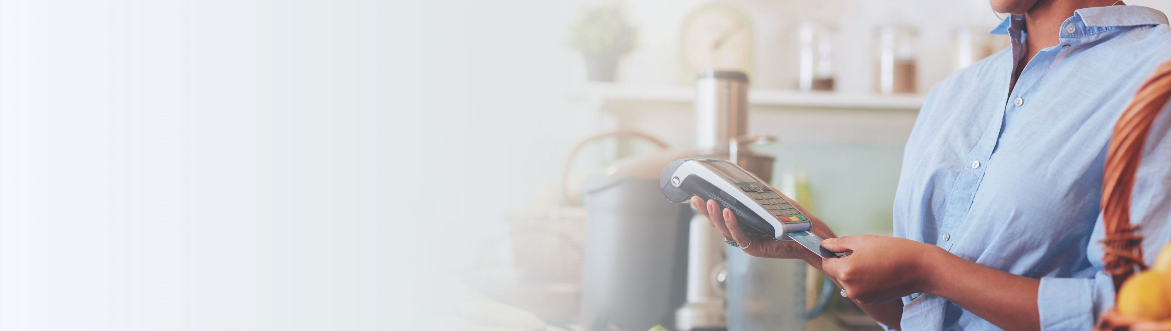 Hands holding a credit card machine