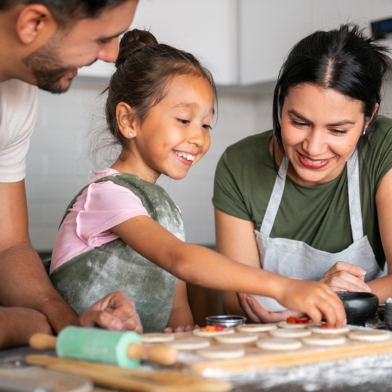 Family baking cookies together.