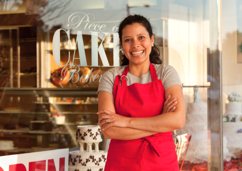 business woman in front of bakery